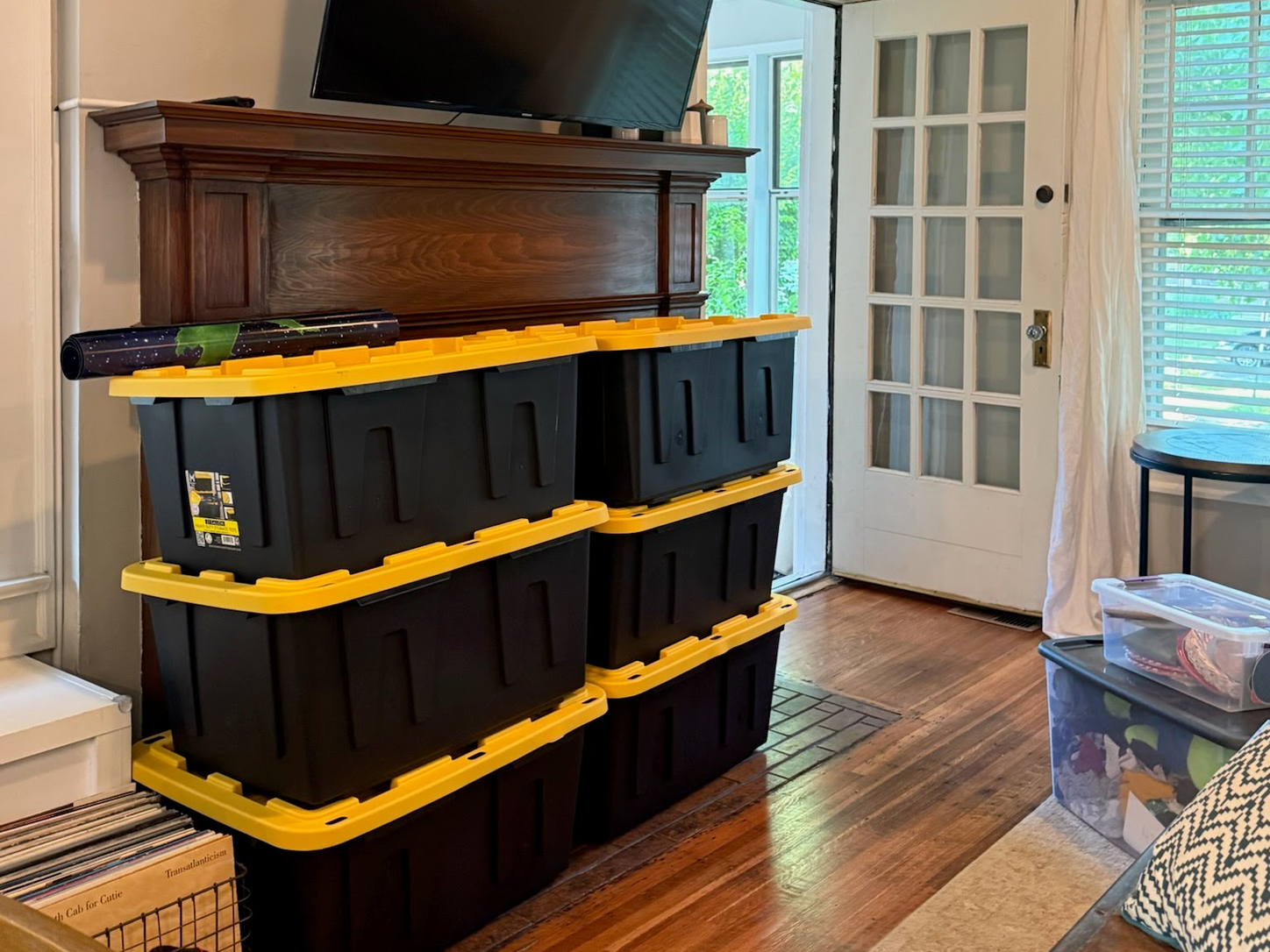 Room interior with black and yellow storage tote unit